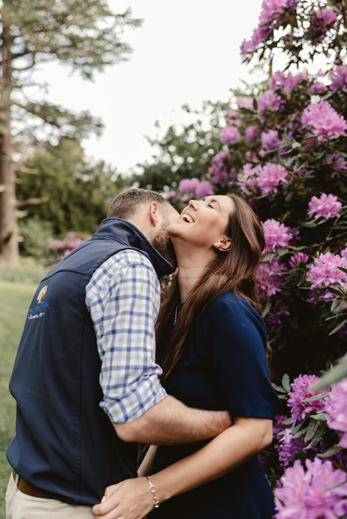 couple kiss and hug in the purple flowers