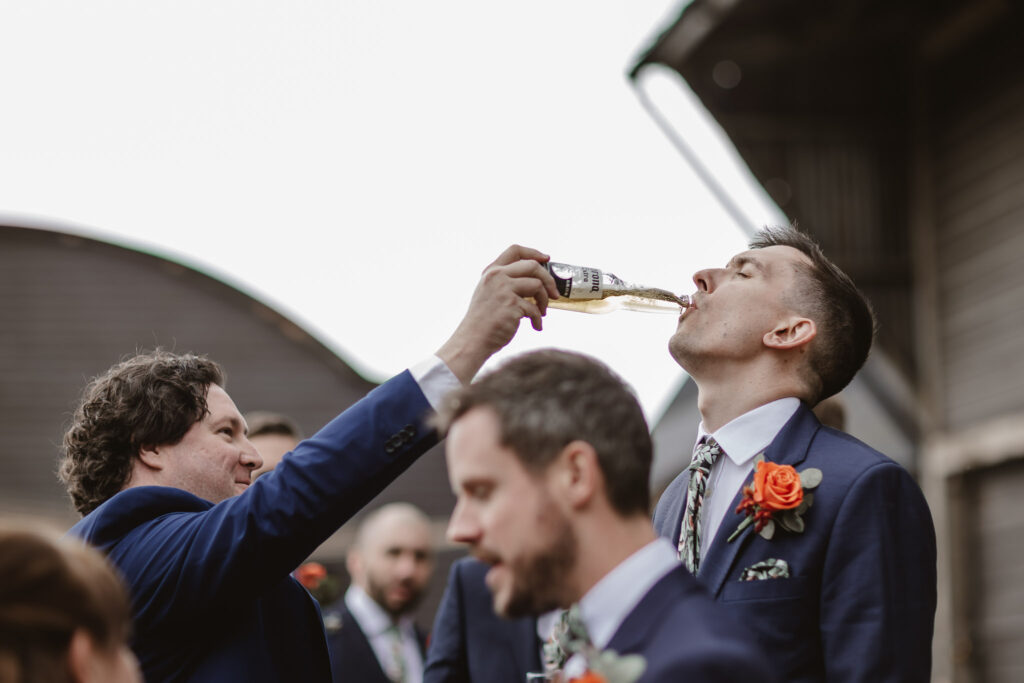 groomsmen drinking beer