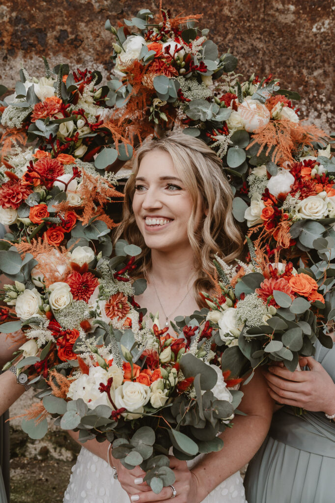 bride smiling with flowers around her face