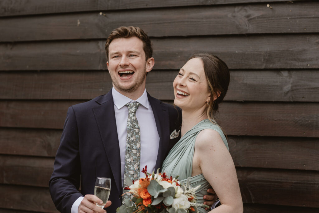 guests drinking a glass of bubbly and smiling