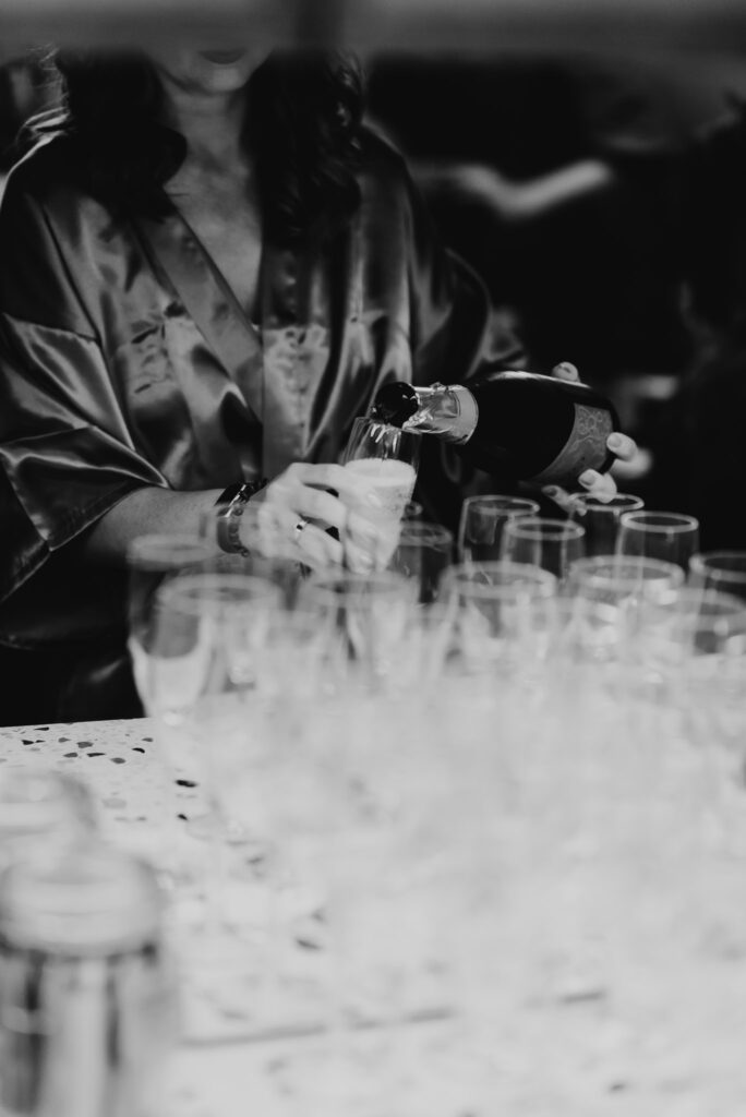 black and white image of glasses of bubbly